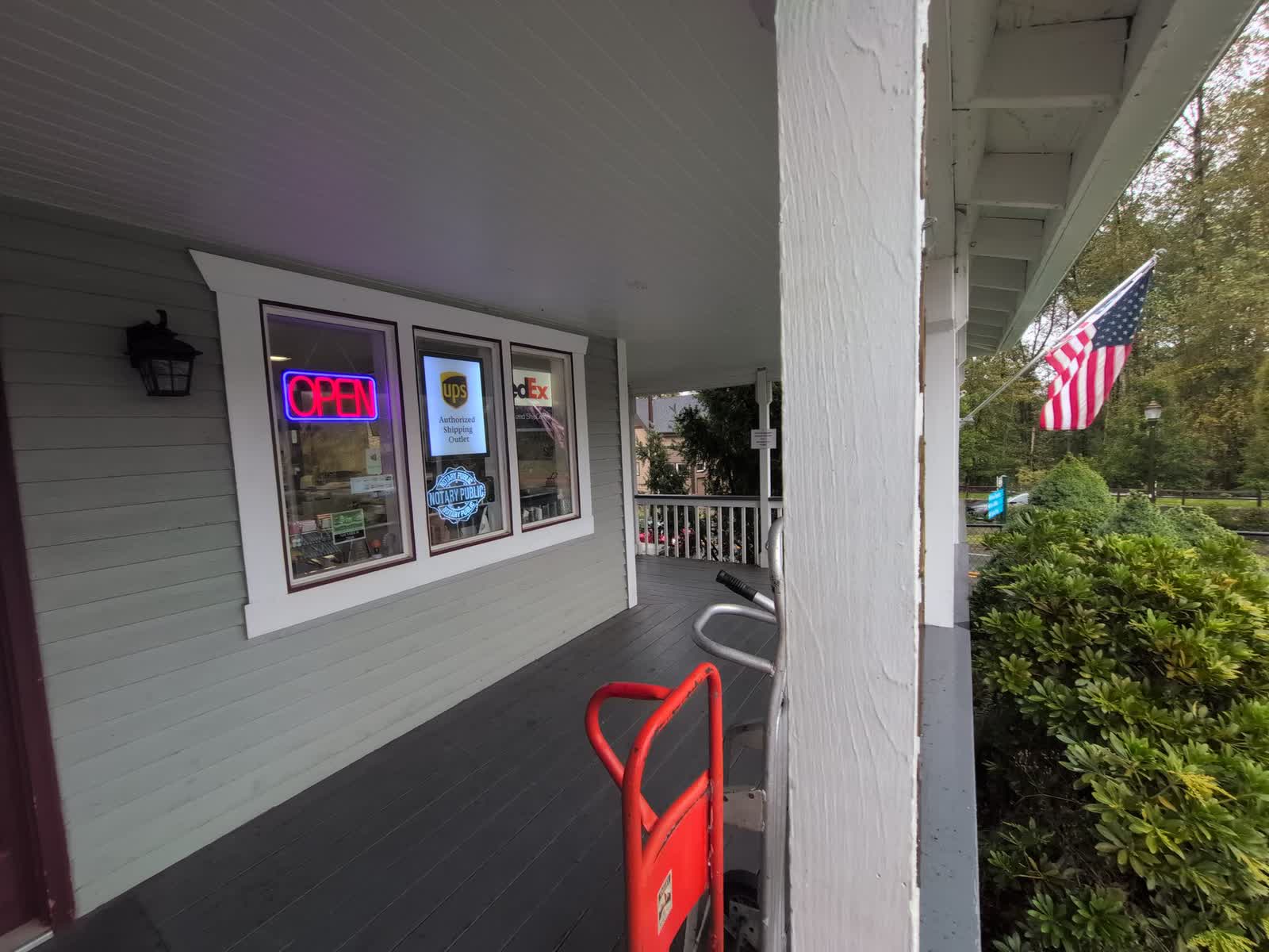 Valley Mail’s front porch, with the Open sign and the UPS and FedEx windows